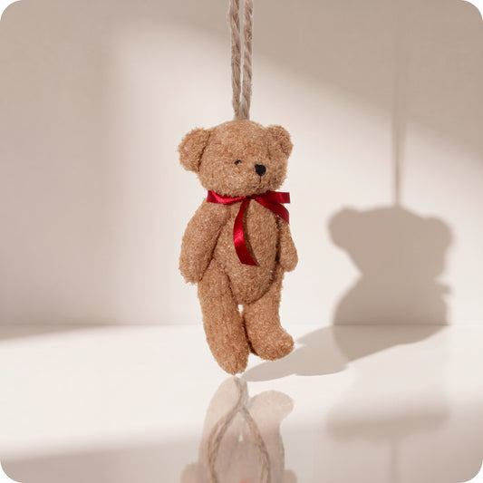 Teddy bear marrón con lazo rojo