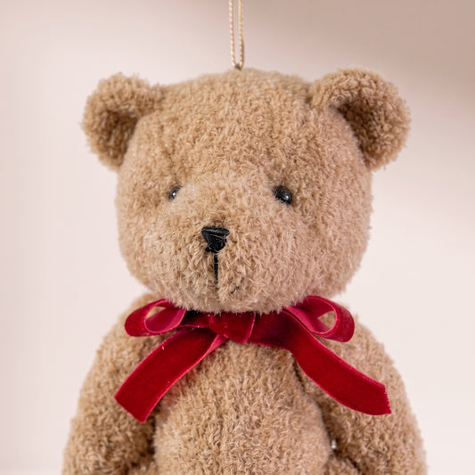 Teddy bear marrón con lazo rojo grande