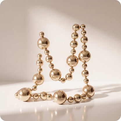 Guirnalda navideña de patron esfera grande y pequeñas champagne brillante