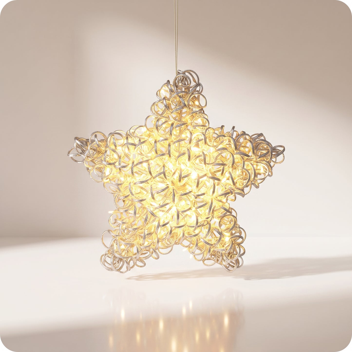 Estrella de red metalica con anillos y luz led calida