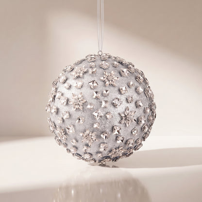 Esfera de piedras brillantes y flores